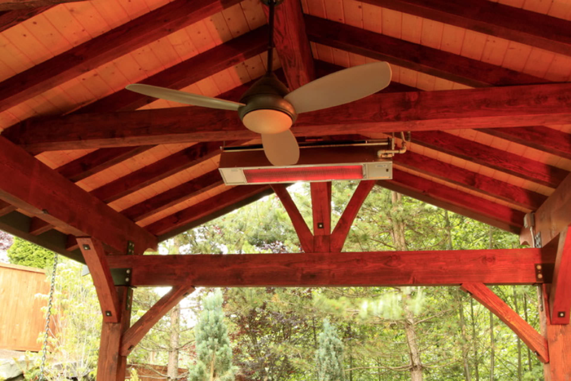 Fan and heater fixed to an outdoor structure