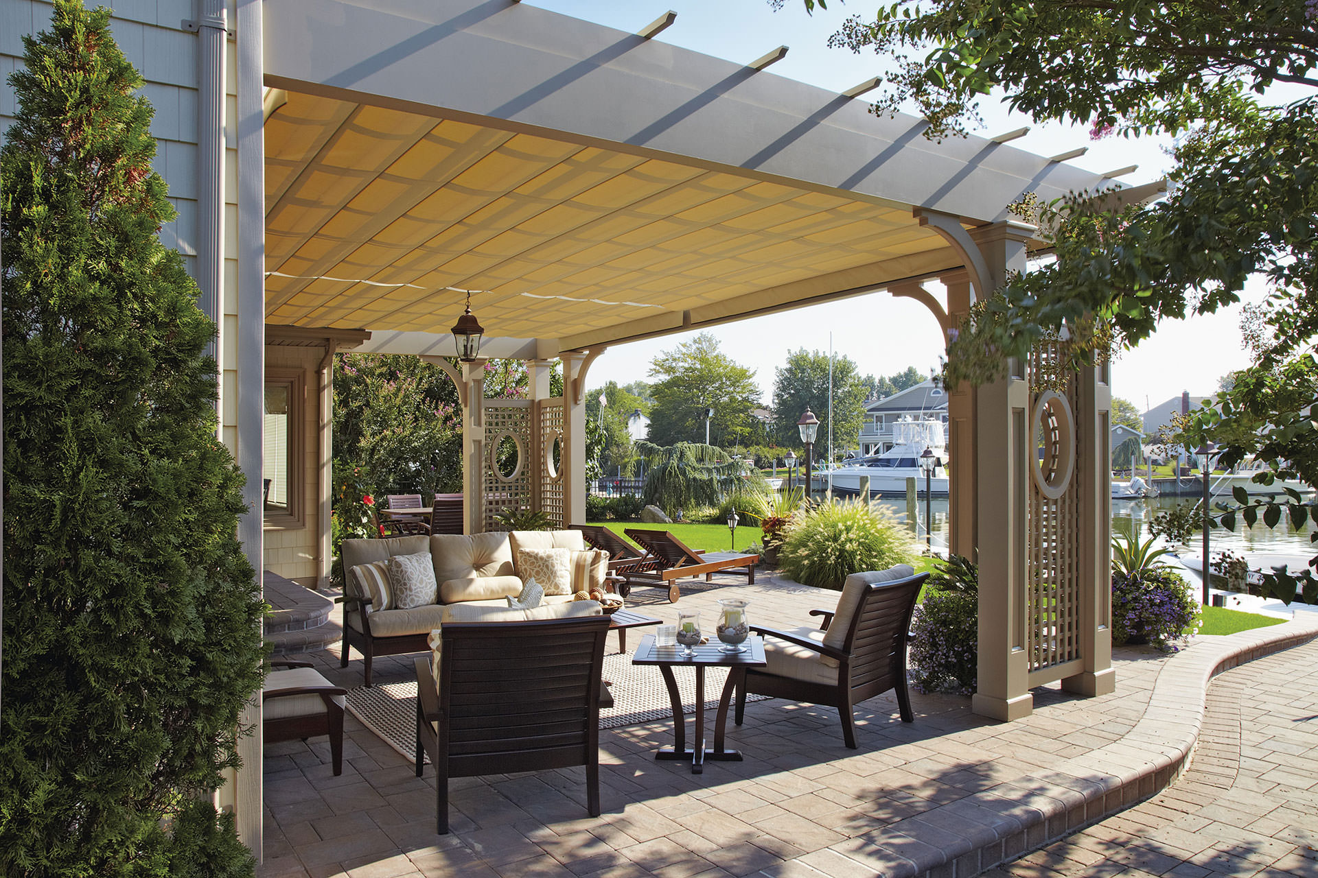 two retractable canopies on a ornate pergola