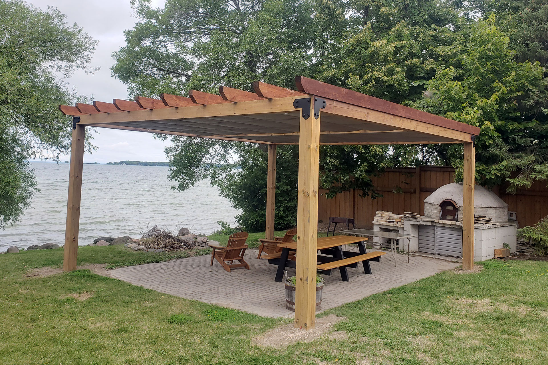 wooden pergola with two retractable canopies